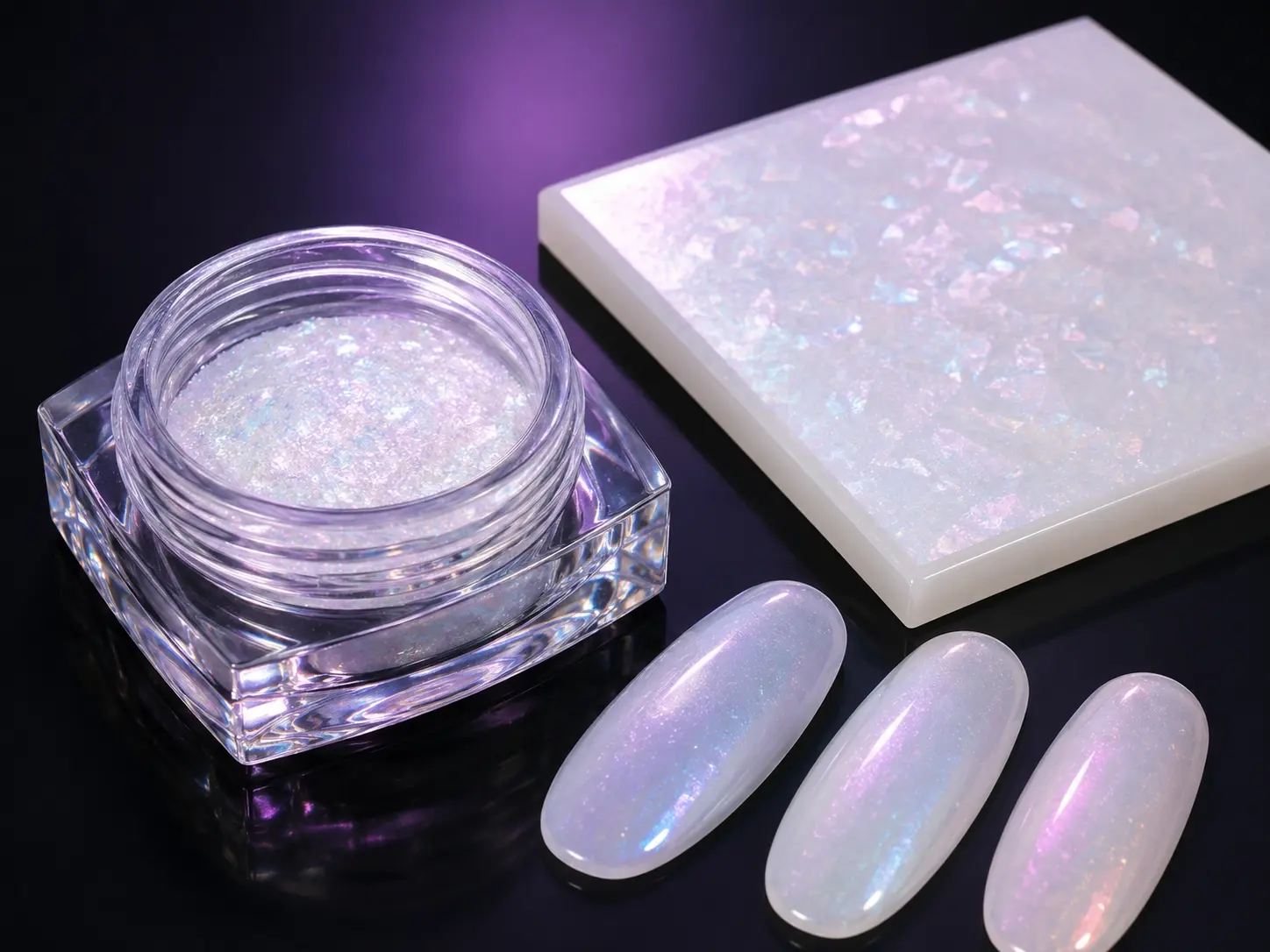Aurora powder applied to white and light base samples showing a soft translucent iridescent effect